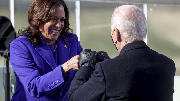 US Vice President Kamala Harris bumps fists with President Joe Biden after she was sworn in during the inauguration in January.