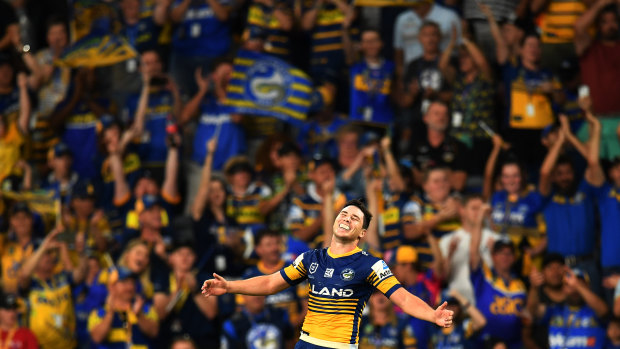 Home and hosed: Mitchell Moses celebrates a try as the Eels christen Bankwest Stadium in style.