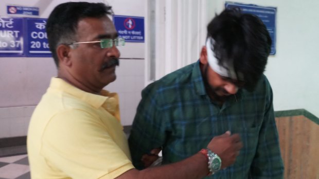 Hit-and-run driver Puneet Puneet (right) leaving court with his uncle in Dehli on Friday.