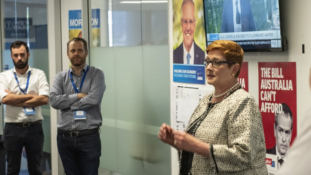 Liberal campaign deputy director Isaac Levido, left, watches as Liberal MP Marise Payne speaks.