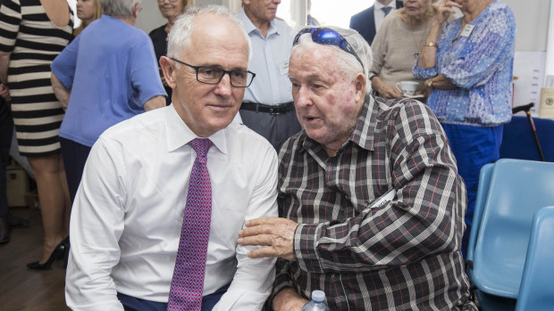 Take my advice, mate: Malcolm Turnbull and local Norm Clarke at a community lunch in Brisbane.