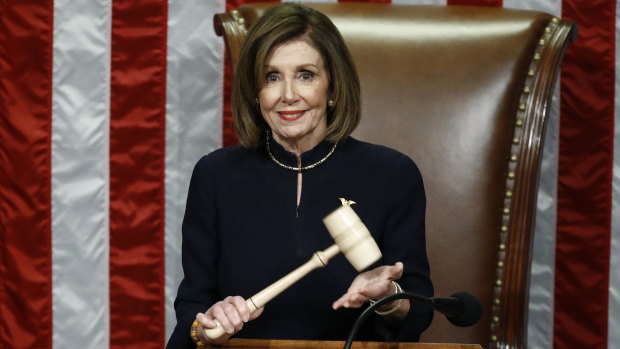 US House Speaker Nancy Pelosi holds the gavel during a vote on the two articles of impeachment.