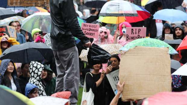 Protesters in Melbourne were greeted by rain.
