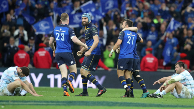 Scott Fardy (middle) and Leinster teammates celebrate at full-time of the final of the European Cup. 