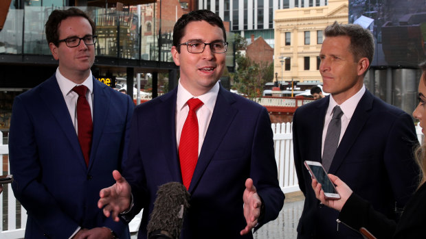 Labor's candidate for Perth, Patrick Gorman at a press conference as Labor's candidate for Fremantle, Josh Wilson (right), and Federal Member for Burt, Matt Keogh, look on.