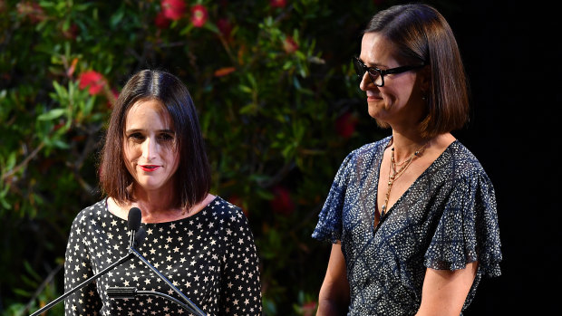 Sally, left, and Pip Kiernan speak during the state memorial service for their father, Ian Kiernan.