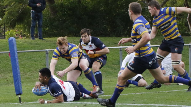 Out wide: Eastwood’s Afa Pakalani scores his side's only try against Sydney University. 
