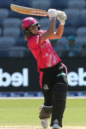 Stand and deliver: Ellyse Perry hits out for the Sixers against the Renegades in Geelong.