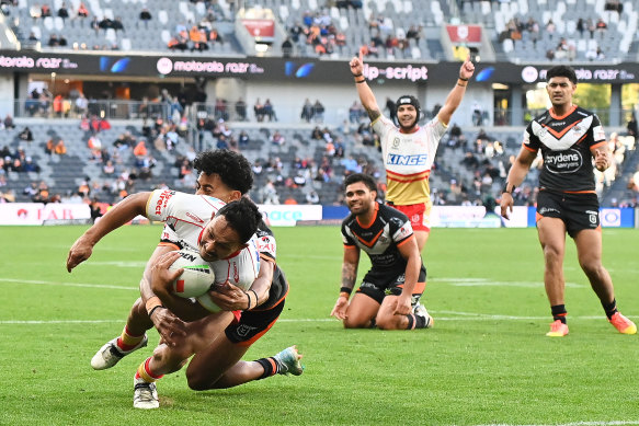 Trai Fuller scoring for the Dolphins against the Wests Tigers last season. 