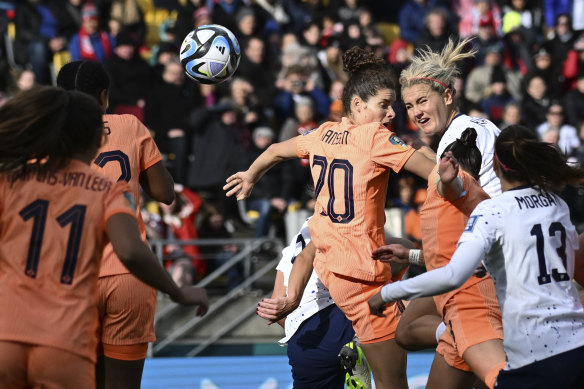 United States’ Lindsey Horan, top right, heads the ball to score her team’s first goal.