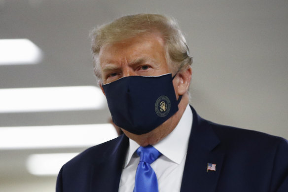 Donald Trump during a rare public appearance in a mask.