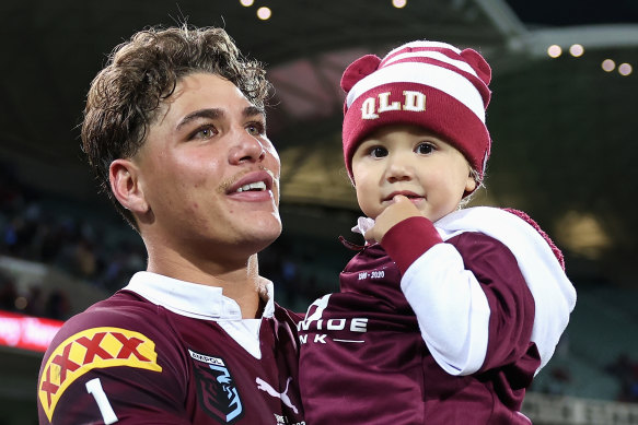 Reece Walsh with his daughter at full-time.