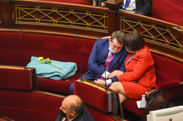 Labor MP Mark Gepp is comforted during an emotional tribute to Jane Garrett in the upper house.