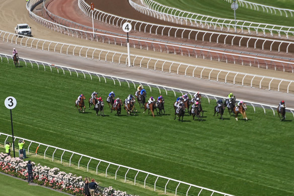 Anthony Van Dyck (at the back of the field) pulls out at the top of the straight in the Melbourne Cup.