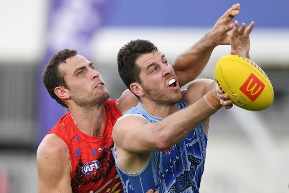 Spoiling effort: Gold Coast’s Jarrod Witts competes with Tristan Xerri.