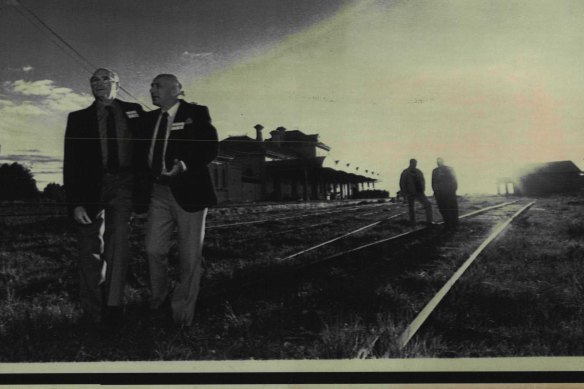 Albert Meyer and Martin Sanders reminisce about old times during a Dunera Boys reunion at Hay Railway Station in 1990. Jimmy King and Walter Kaufmann in the background.