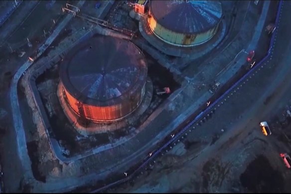 Russian Emergency Situations Ministry trucks work at the scene of an oil spill at a power plant in Norilsk.