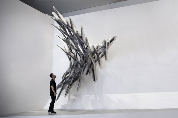 Roland Snooks with his “Unclear Cloud” carbon fibre sculpture.