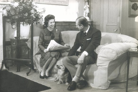 One of a special series of pictures taken in connection with the Silver Jubilee.  The Queen and the Duke of Edinburgh with Tinker, a cross between a corgi and long-haired dachshund.