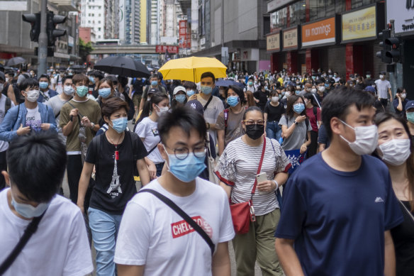 Demonstrators wearing protective masks march during a protest against a planned national security law in the Wan Chai district in Hong Kong, China, on Sunday, May 24.