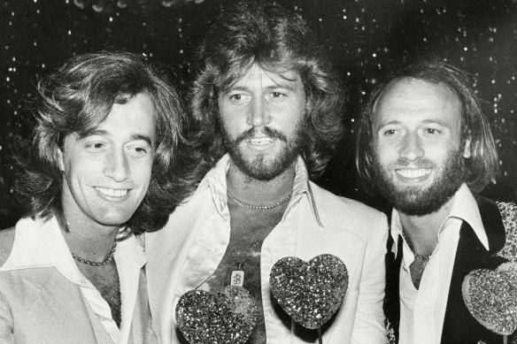 The Bee Gees, from left, Robin, Barry and Maurice Gibb, attend a party following the Hollywood premiere of Sgt. Pepper's Lonely Hearts Club Band in a still from the documentary The Bee Gees: How Can You Mend a Broken Heart?