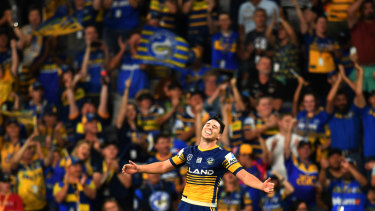 Home and hosed: Mitchell Moses celebrates a try as the Eels christen Bankwest Stadium in style.