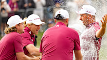 Individual champion Lucas Herbert, right, of Ripper GC, celebrates after his win with teammates Cameron Smith, Marc Leishman and Travis Smyth.