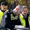 Detectives at the scene of the Chadstone house fire on Thursday.