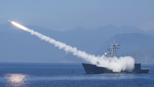 A Taiwanese frigate fires an anti-air missile. Chinese and Taiwanese and Chinese forces have staged rival military demonstrations in the Taiwan Strait amid heightened tensions.