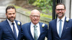 Rupert Murdoch, flanked by his two sons, James, right, and Lachlan.