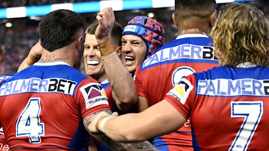 Kalyn Ponga and the Knights celebrate after a try.