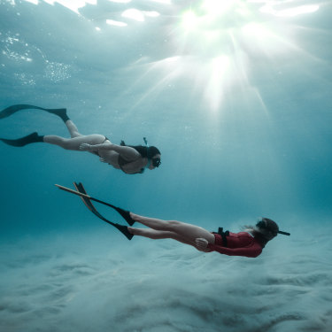 Free-diving off North Bondi. “The ocean is a great healer,” says instructor Bella Massey, right. 