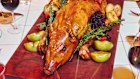 The suckling pig at La Grande Boucherie in New York. Whole-animal centrepieces are among the lavish dishes popping up on many restaurant menus.