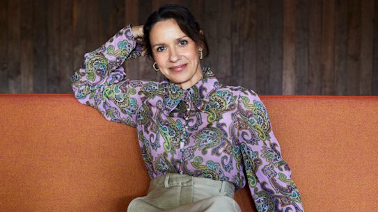 Kate wears Scanlan Theodore blouse and trousers, Reliquia earrings, Zara mules.