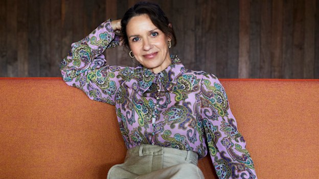 Kate wears Scanlan Theodore blouse and trousers, Reliquia earrings, Zara mules.