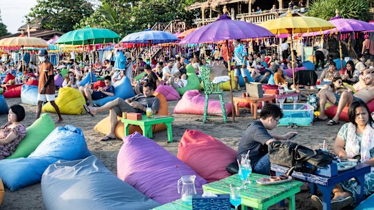 Tourists at a beach club in Seminyak, Bali, Indonesia, on Friday, May 6, 2022. With the broader reopening, fully vaccinated visitors from overseas to Bali no longer need to quarantine. Photographer: Putu Sayoga/Bloomberg via Getty Images Getty image for Traveller. Single use only.