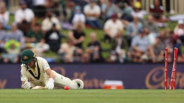Marnus Labuschagne lies helpless after tangling himself up, falling over and being bowled by Stuart Broad in Hobart.