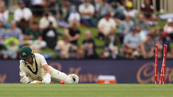 Marnus Labuschagne lies helpless after tangling himself up, falling over and being bowled by Stuart Broad in Hobart.