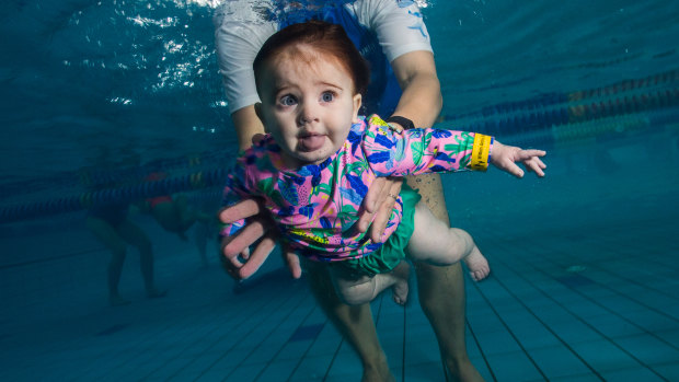 Wide-eyed: Six-month-old Piya Sharma heads under water with swim instructor Tanya Laube.