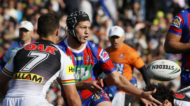 Pin-up: Kalyn Ponga directs traffic after switching to five-eighth for the Knights