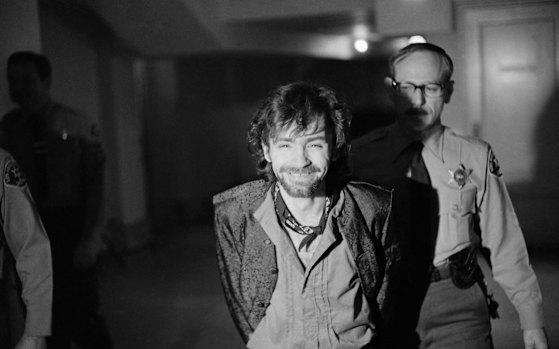 A smiling Charles Manson goes to lunch after an outbreak in court that resulted in his ejection, along with three women co-defendants, from the Tate murder trial, Dec. 21, 1970. 