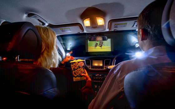 Rain didn't dampen Tilly and Matthew's movie experience at Dandenong's Lunar Drive-in last night.