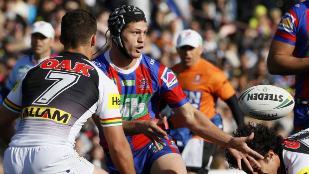Pin-up: Kalyn Ponga directs traffic after switching to five-eighth for the Knights.