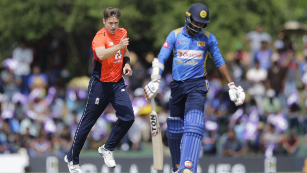 Got him: England's Chris Woakes celebrates the dismissal of Sri Lanka's Upul Tharanga.