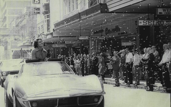 Ticker tape rained down and thousands of pedestrians cheered wildly as Wimbledon Champion Evonne Goolagong drove through Sydney city streets. August 23, 1971.