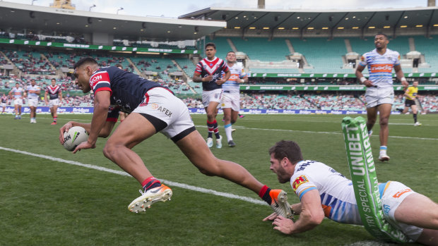 Too easy: Daniel Tupou goes over for another Roosters try.