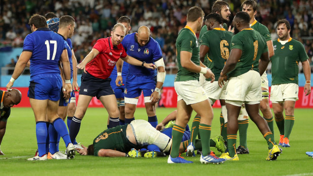 South Africa's Duane Vermeulen goes down injured after a dangerous tackle by Andrea Lovotti that led to his send-off.