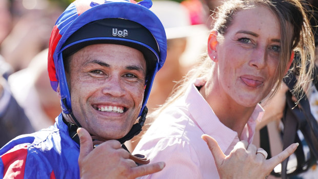 Jockey Michael Walker and handler Natasha Eaton pose.