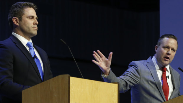 Republican primary senatorial candidate Corey Stewart, right, gestures as state Delegate Nick Freitas listens during a debate at Liberty University in Lynchburg, Virginia.