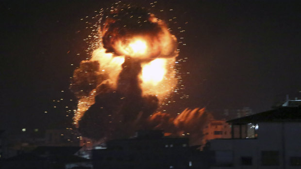 An explosion caused by Israeli airstrikes is seen from the offices of a Hamas leader on Monday. Despite a ceasefire, bombing resumed early on Tuesday.
